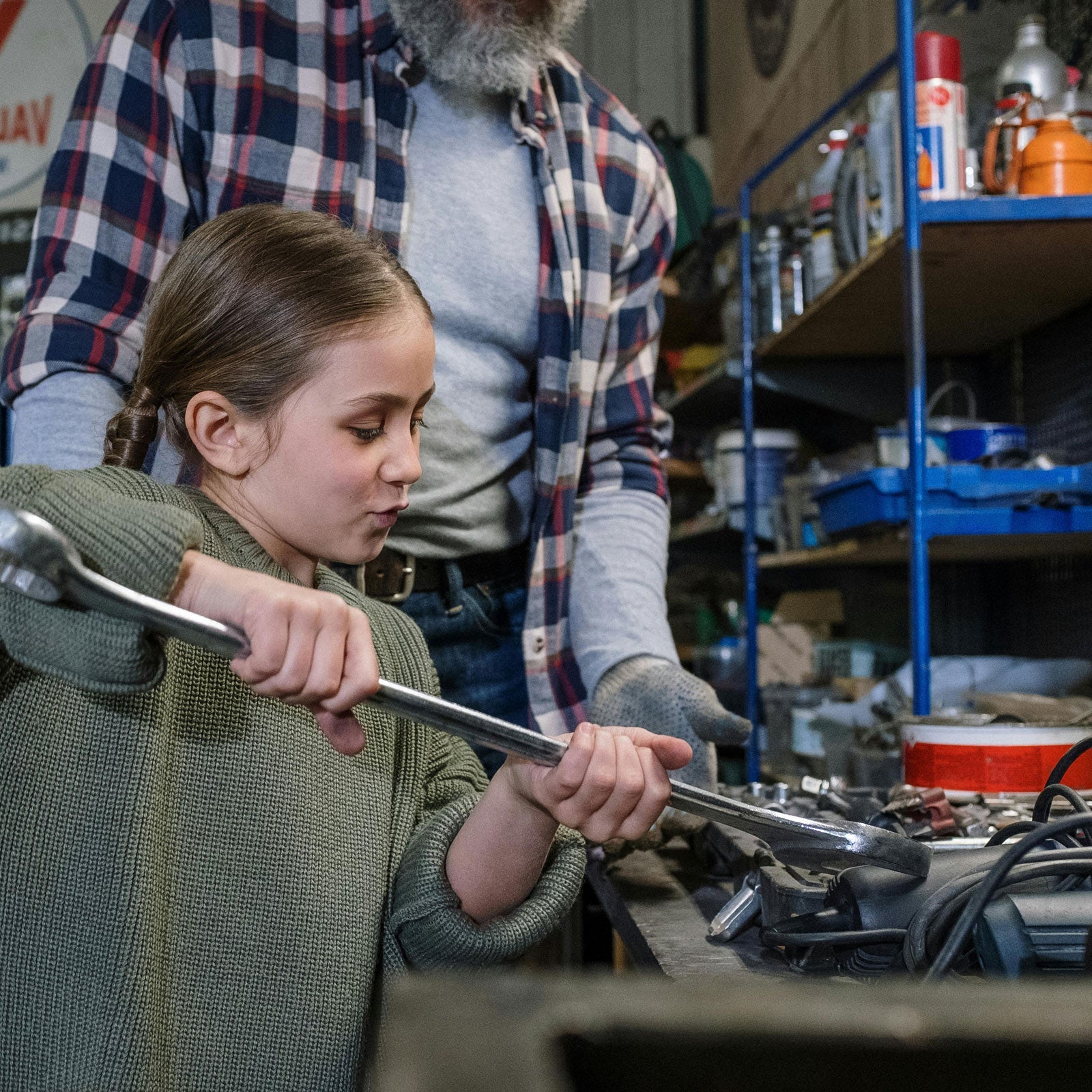 A lifestyle photo of a father and son working on a project together